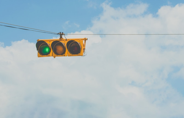 A stoplight with the green light illuminated