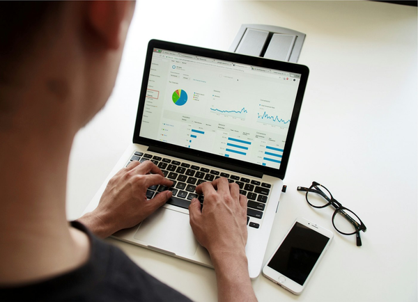 Person looking at a dashboard on a laptop